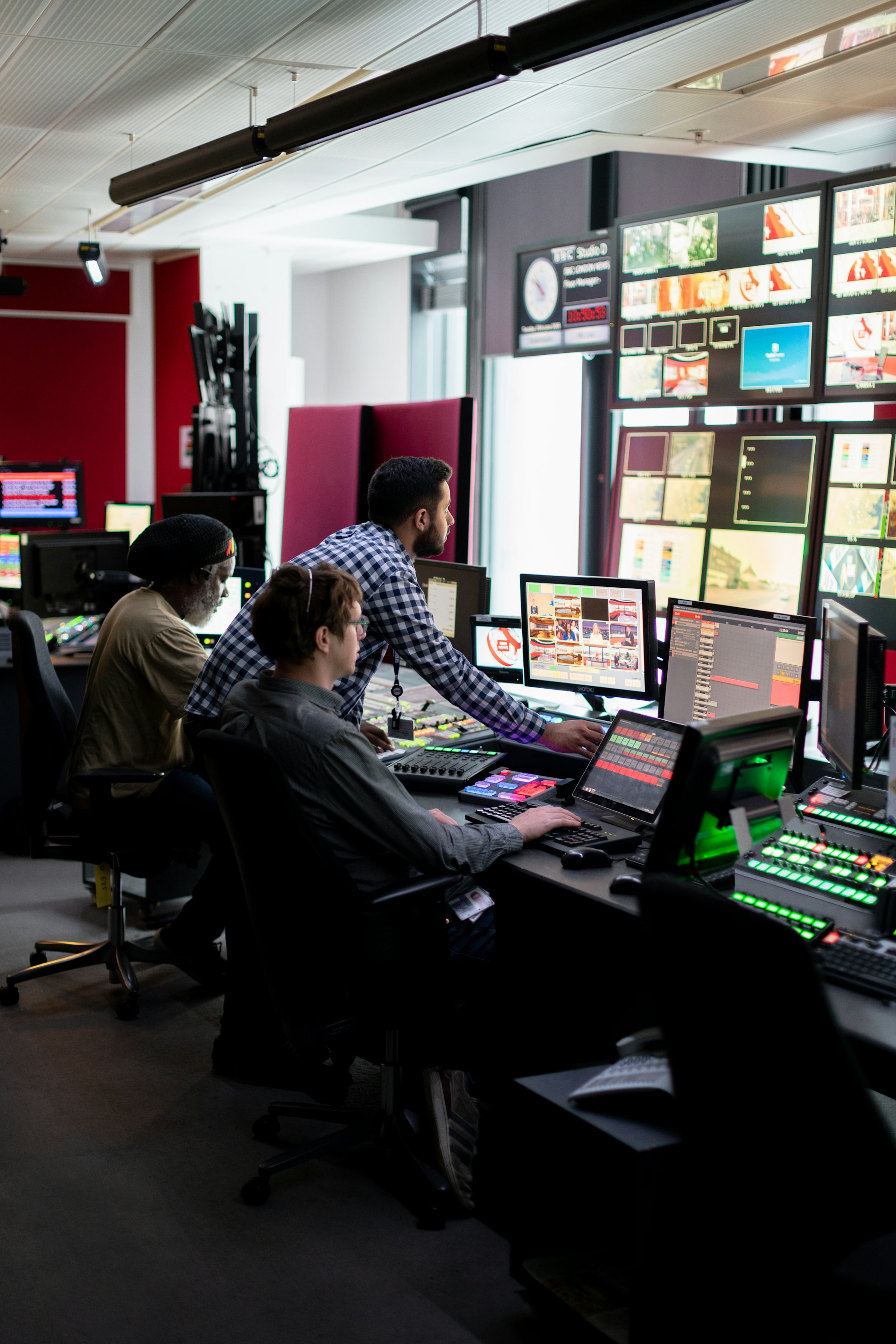Control room operators monitoring systems